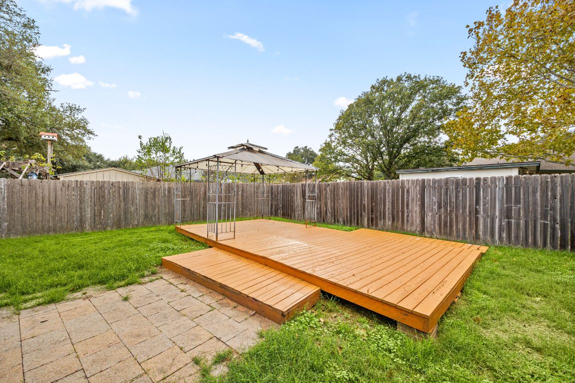 2602 Armstrong Drive Leander, TX 78641 - Photo 21 of 22 a view of a backyard with wooden fence