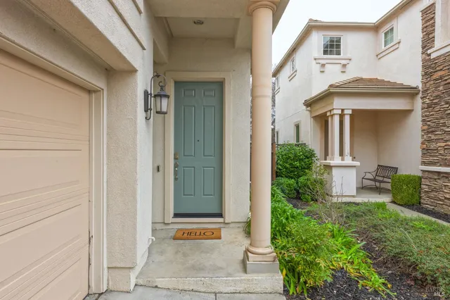 a view of a hallway with wooden floor and closet
