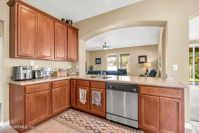 a kitchen with sink cabinets and window