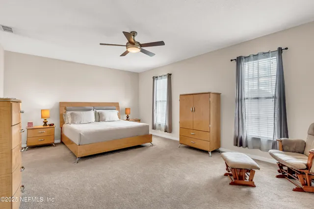 a bedroom with bed and window