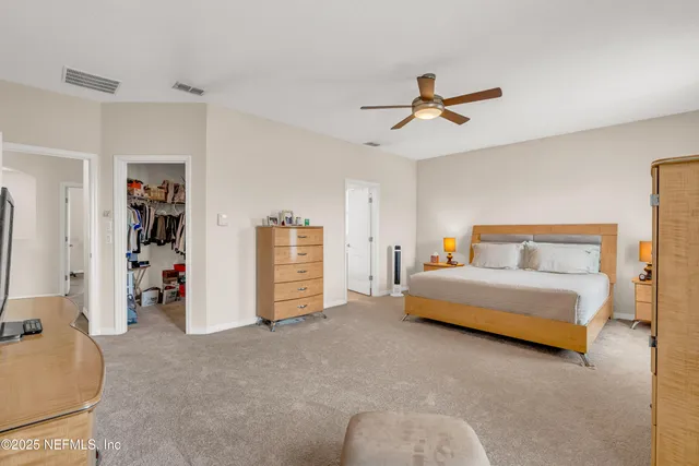 a bedroom with bed and window