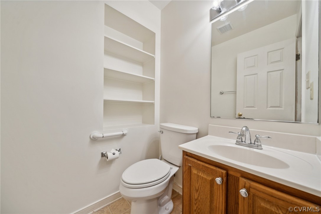 1725 Abbot's Mill Way Midlothian, VA 23114 - Photo 15 of 30 a bathroom with a sink toilet and vanity