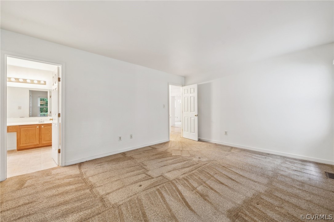 1725 Abbot's Mill Way Midlothian, VA 23114 - Photo 17 of 30 a view of an empty room and a kitchen