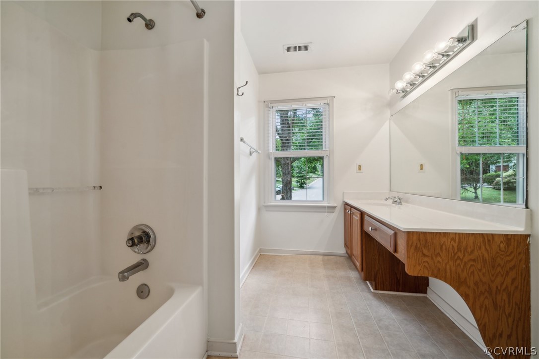 1725 Abbot's Mill Way Midlothian, VA 23114 - Photo 23 of 30 a bathroom with a tub sink and window