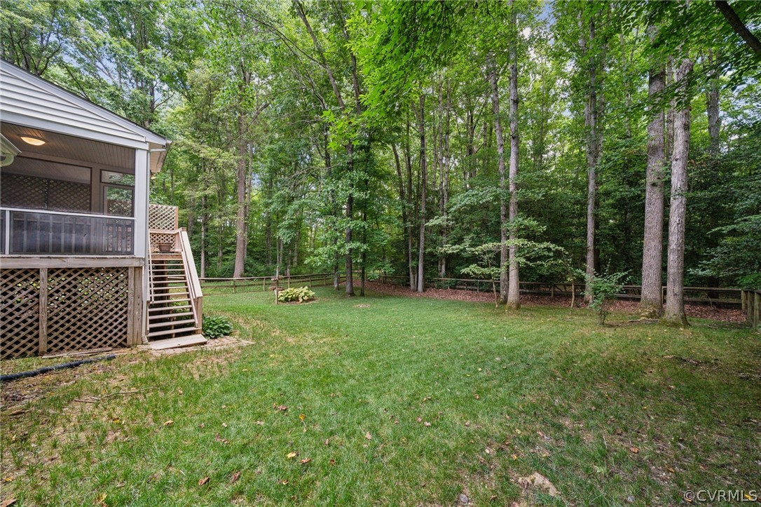 1725 Abbot's Mill Way Midlothian, VA 23114 - Photo 28 of 30 a backyard of a house with plants and large tree