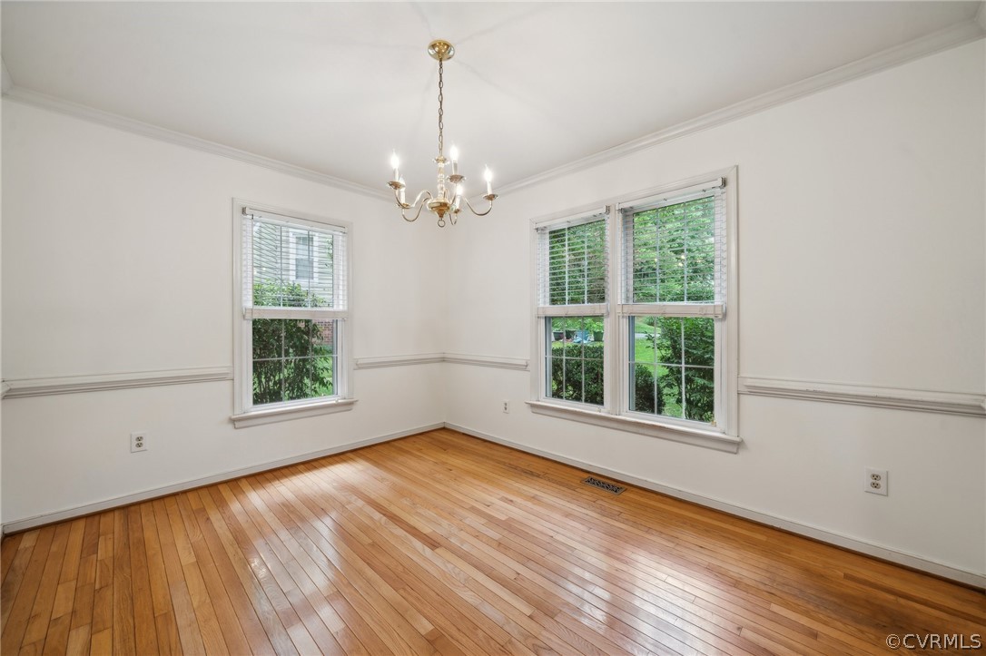 1725 Abbot's Mill Way Midlothian, VA 23114 - Photo 5 of 30 a view of an empty room with a window and wooden floor