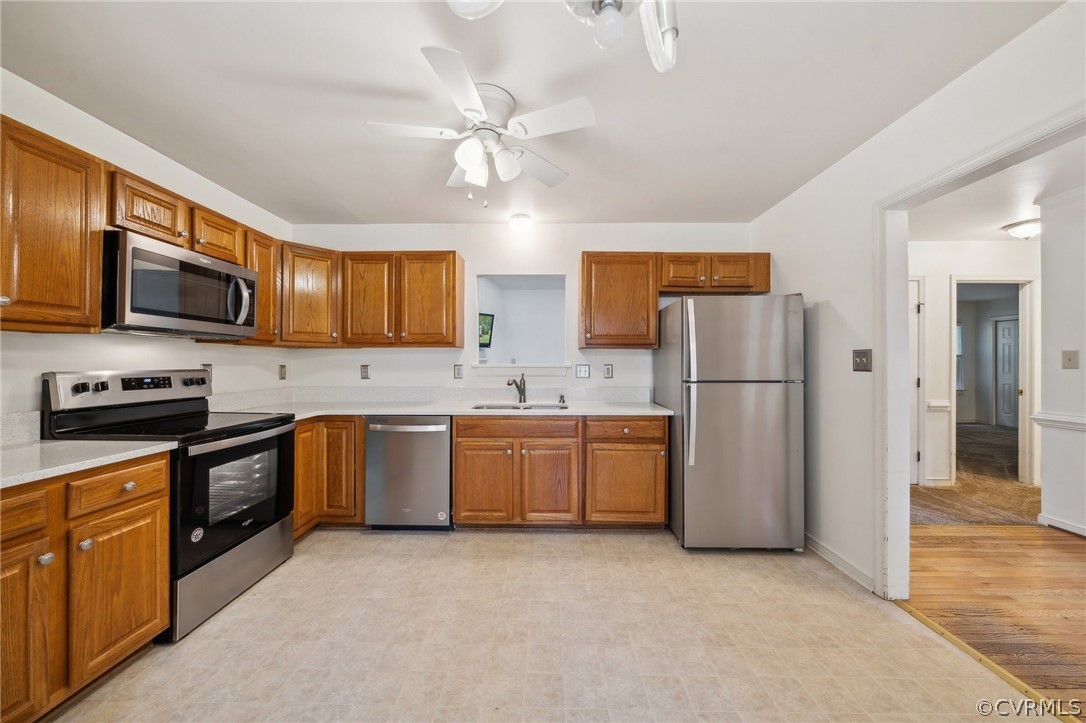 1725 Abbot's Mill Way Midlothian, VA 23114 - Photo 6 of 30 a kitchen with a refrigerator a microwave a sink and cabinets