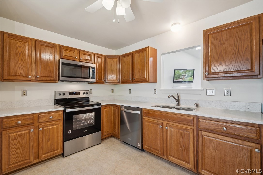 1725 Abbot's Mill Way Midlothian, VA 23114 - Photo 8 of 30 a kitchen with stainless steel appliances granite countertop a sink stove and microwave
