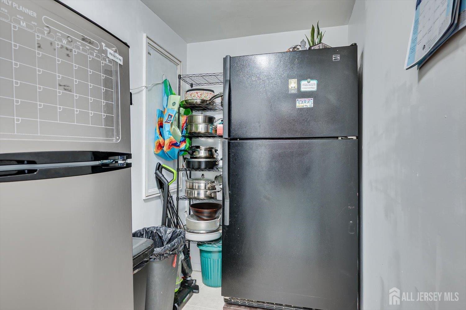15 Markham Road Edison, NJ 08817 - Photo 14 of 32 a white refrigerator freezer and a stove sitting inside of a kitchen