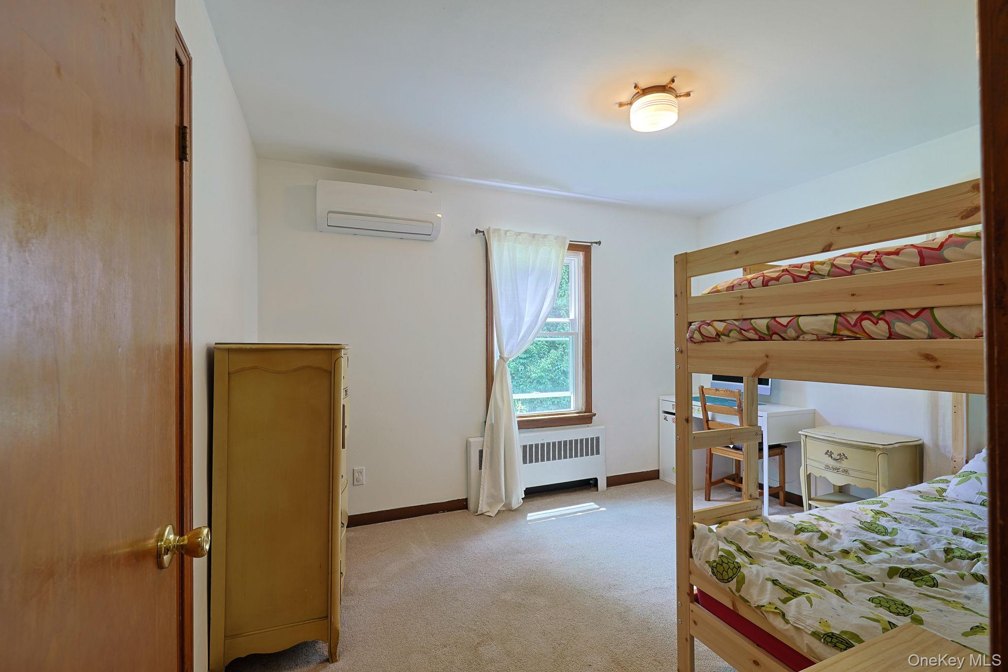 178 Mt Airy Road New Windsor, NY 12553 - Photo 13 of 31 a bedroom with a bed and a window