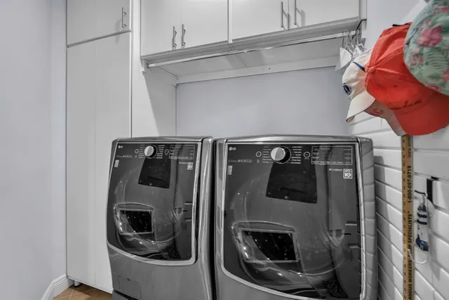 a bedroom with a bed and a chair