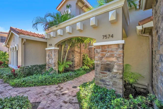 a view of a two chairs in the balcony