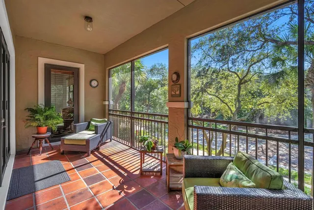 a view of a street with benches sitting next to a road