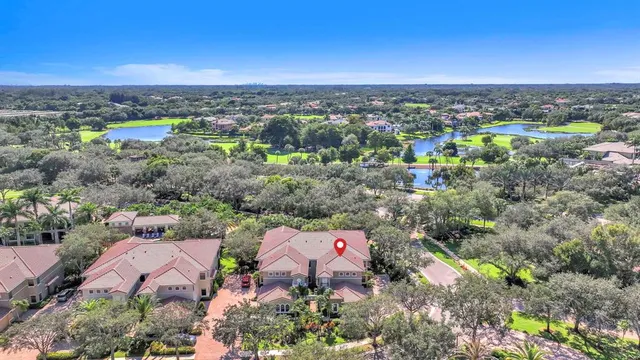 a large white kitchen with a table and chairs