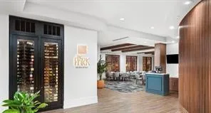 a view of a room with furniture and windows