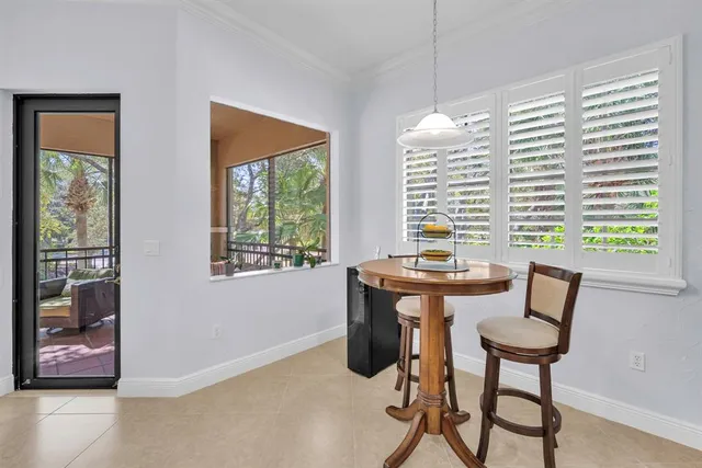 a view of a dining room with furniture and window