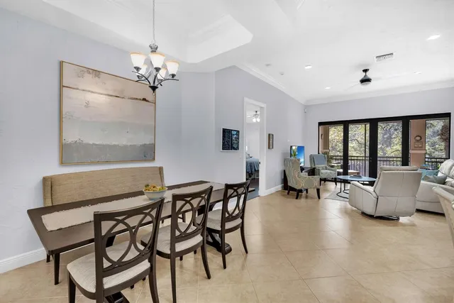 a bathroom with a granite countertop sink a mirror and shower