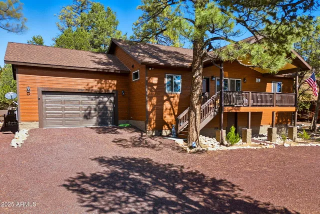 a view of a house with basket ball court