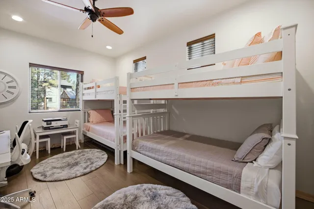 a bedroom with a bed and flat screen tv