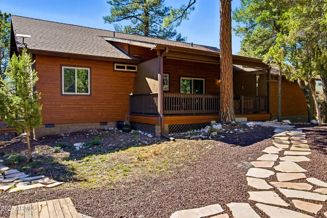 a tree in front of a house