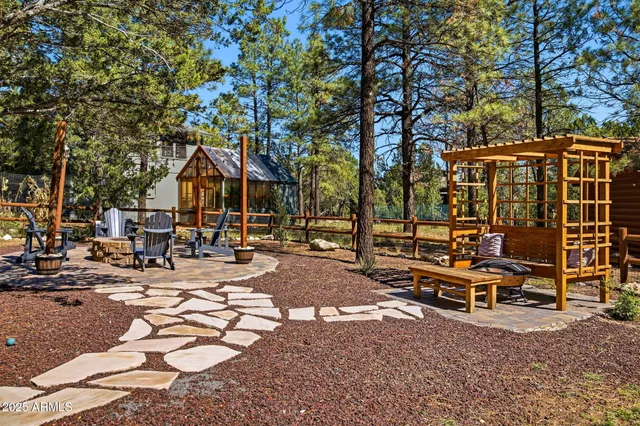 a view of a chairs and table in the patio