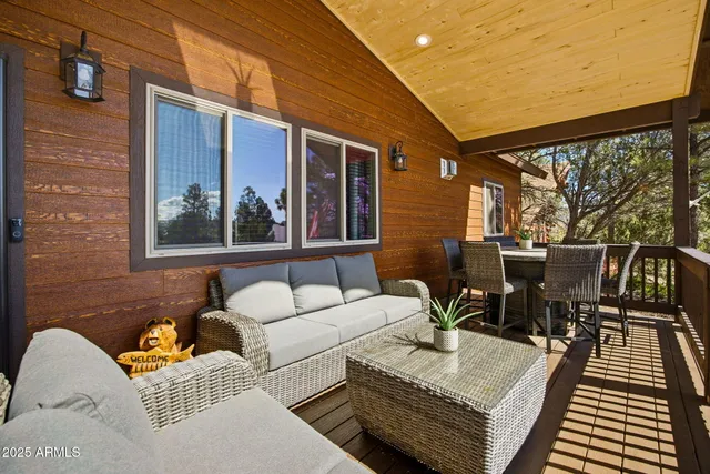 a view of a house with a yard and sitting area