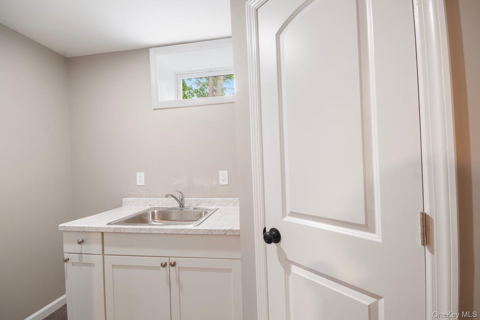 568 Granny Road Medford, NY 11763 - Photo 12 of 22 Laundry area with a sink