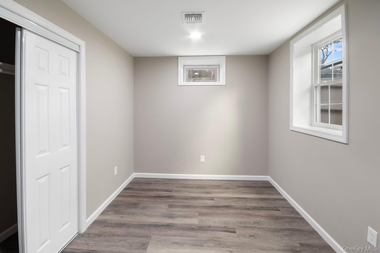 568 Granny Road Medford, NY 11763 - Photo 14 of 22 Unfurnished bedroom featuring light wood-type flooring and baseboards