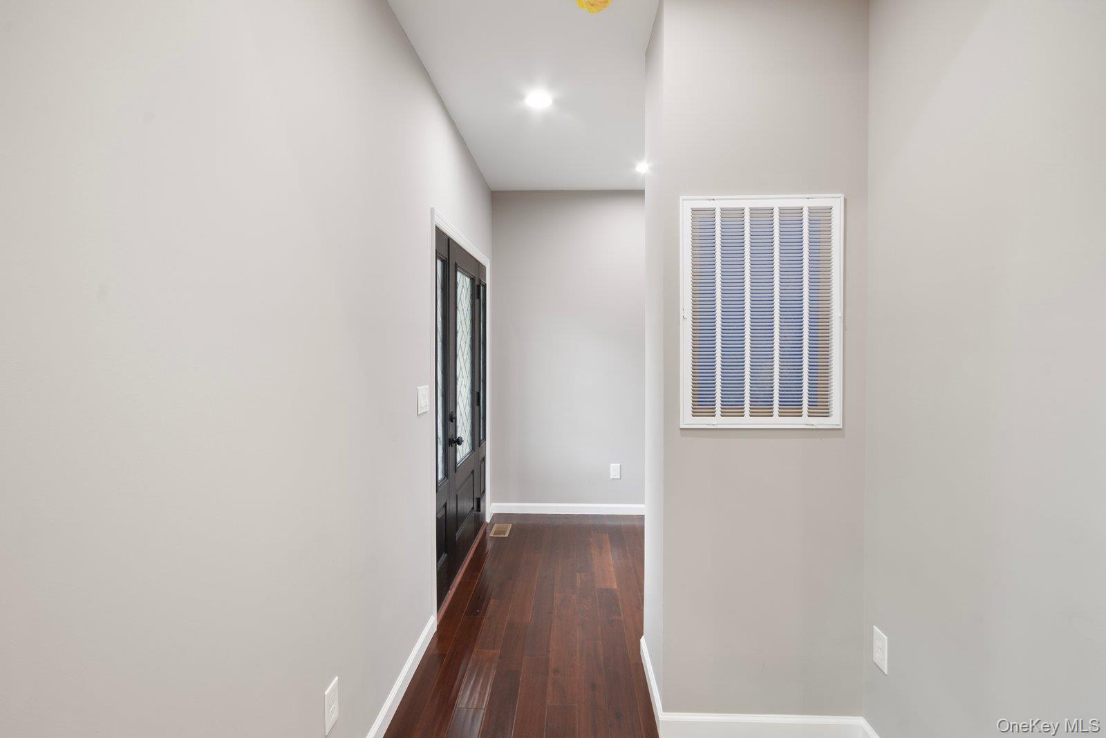 568 Granny Road Medford, NY 11763 - Photo 2 of 22 Hallway with dark wood-style floors and recessed lighting