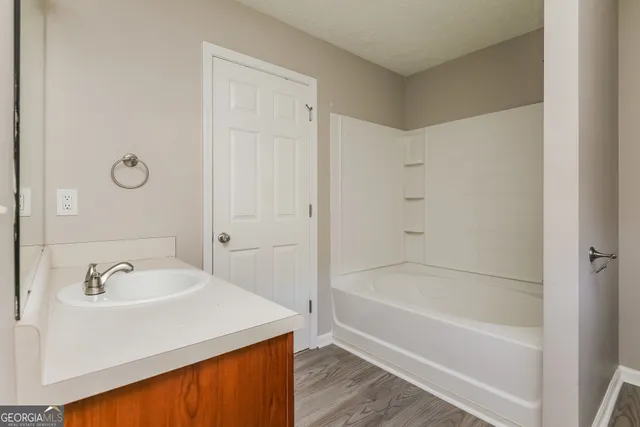 a bathroom with a sink and a bathtub