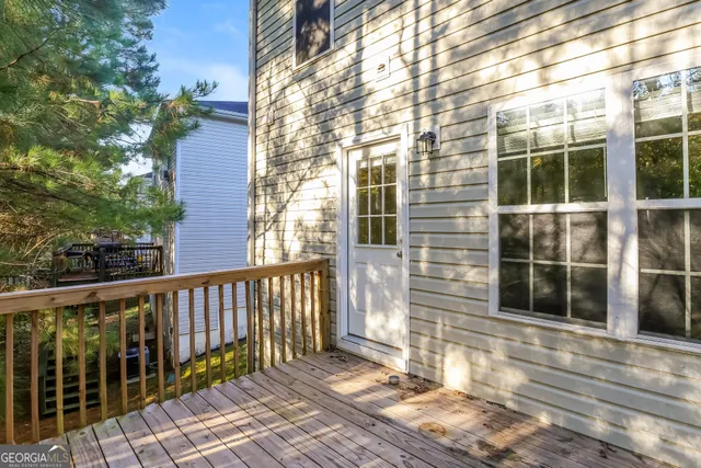 a view of a brick house with large windows