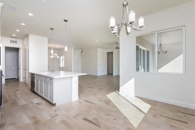 a large bathroom with a large tub and sink