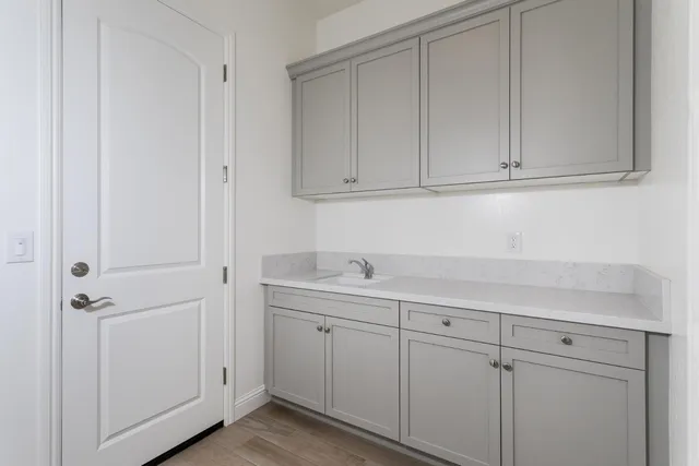 a view of cabinets and white cabinets