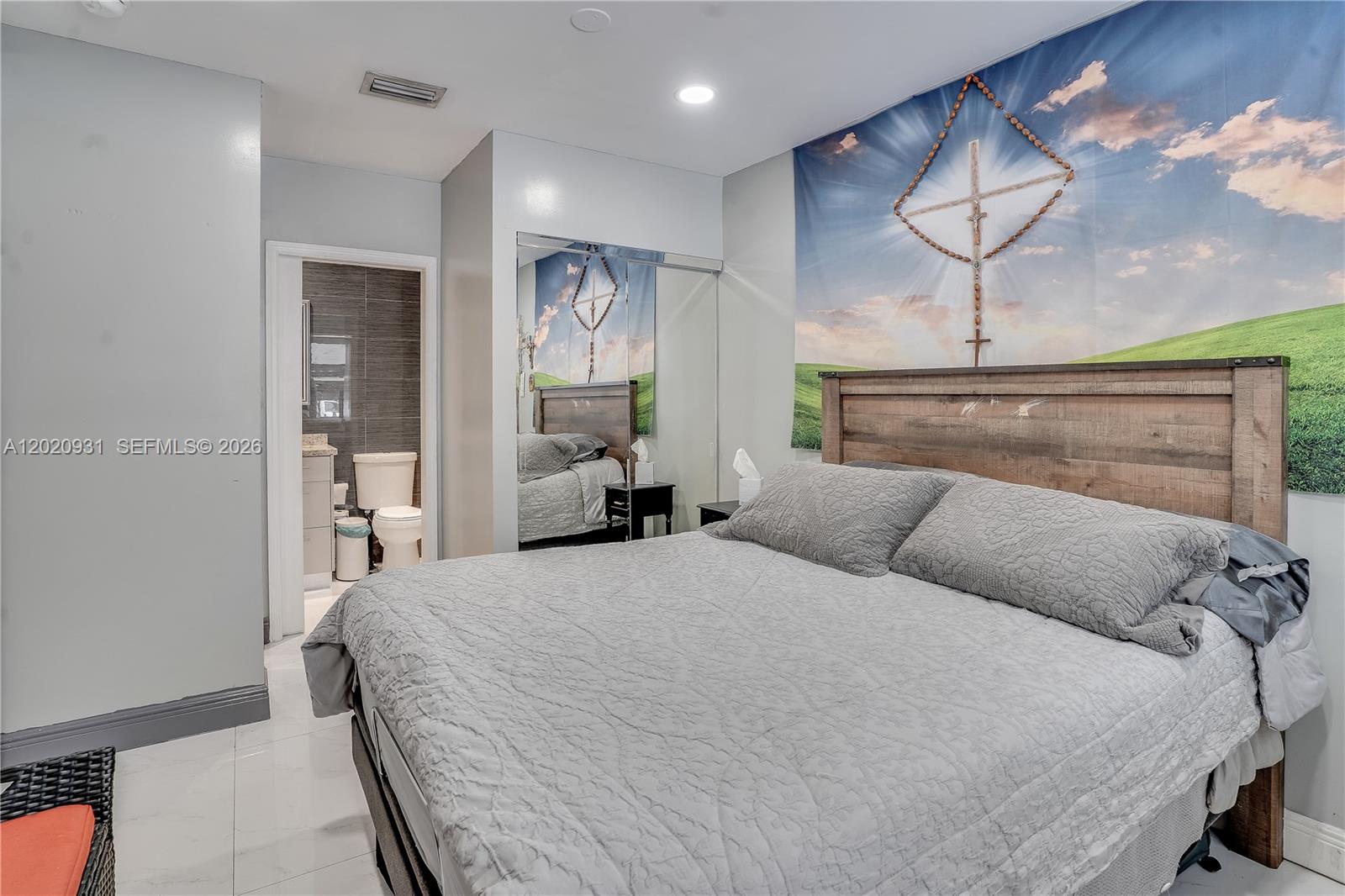 1360 Northwest 77th Street Miami, FL 33147 - Photo 21 of 41 a bedroom with a bed and painting on the wall