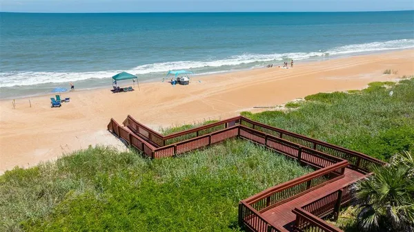 a view of a backyard with a ocean view