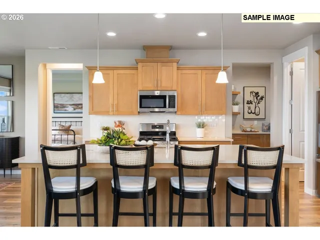 a en suite bathroom with a tub double vanity window and 2 sink