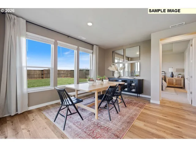 a bedroom with two beds and painting on the wall