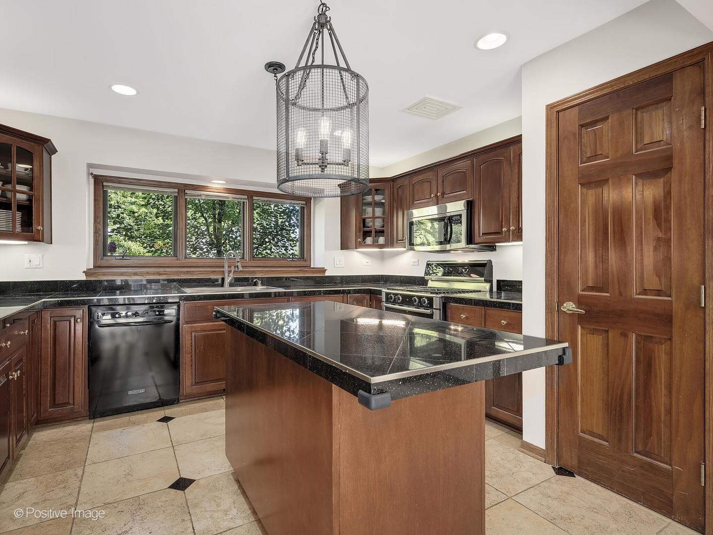 541 68th Street Willowbrook, IL 60527 - Photo 15 of 43 a kitchen with stainless steel appliances granite countertop a sink stove and refrigerator