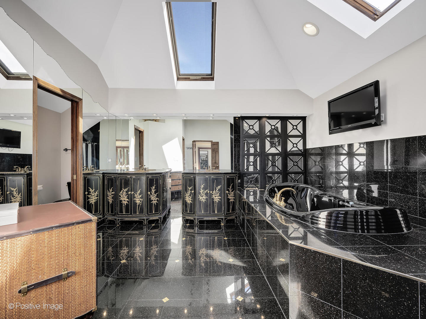 541 68th Street Willowbrook, IL 60527 - Photo 22 of 43 a kitchen with a stove a sink and a dining table with chairs