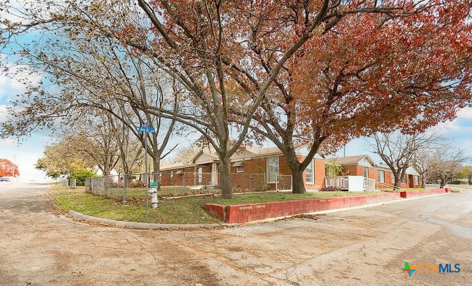 111 South 33rd Street Temple, TX 76504 - Photo 3 of 28 a view of outdoor space with swimming pool and trees