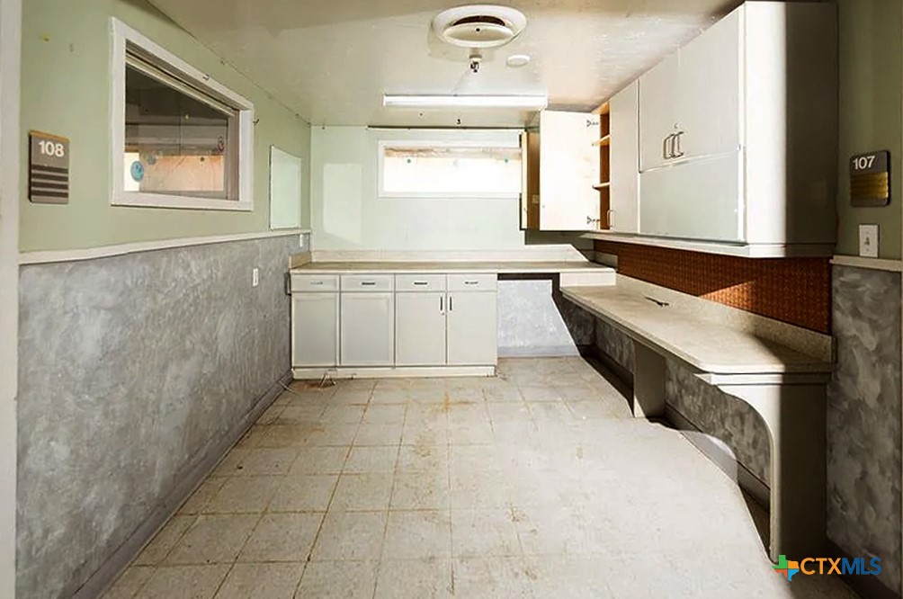 111 South 33rd Street Temple, TX 76504 - Photo 8 of 28 a bathroom with a tub sink and mirror