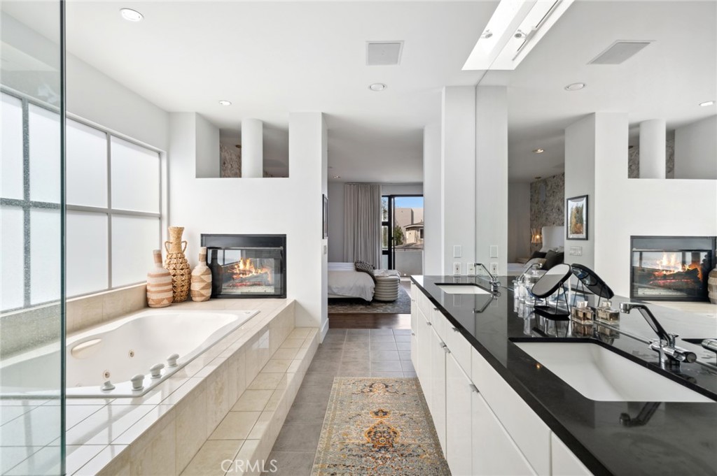 2831 Ridge Drive Laguna Beach, CA 92651 - Photo 18 of 21 a large white kitchen with a large window and stainless steel appliances