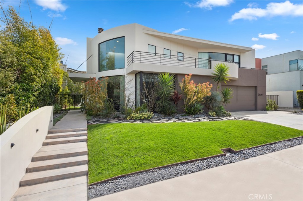 2831 Ridge Drive Laguna Beach, CA 92651 - Photo 2 of 21 a front view of a house with garden