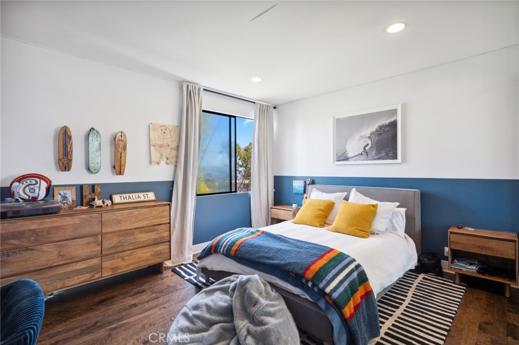 2831 Ridge Drive Laguna Beach, CA 92651 - Photo 21 of 21 a bedroom with a bed and a dresser