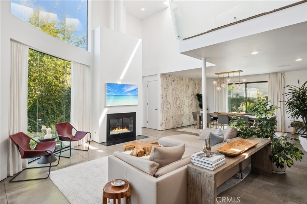2831 Ridge Drive Laguna Beach, CA 92651 - Photo 3 of 21 a living room with furniture fireplace and a large window