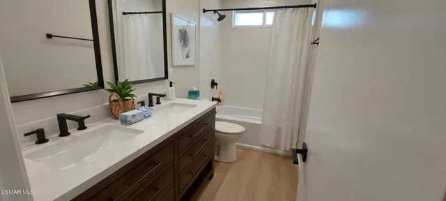 a bedroom with a bed and a chair