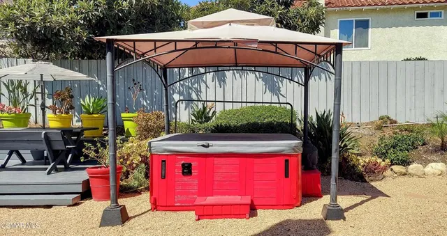 an outdoor space with furniture and umbrella