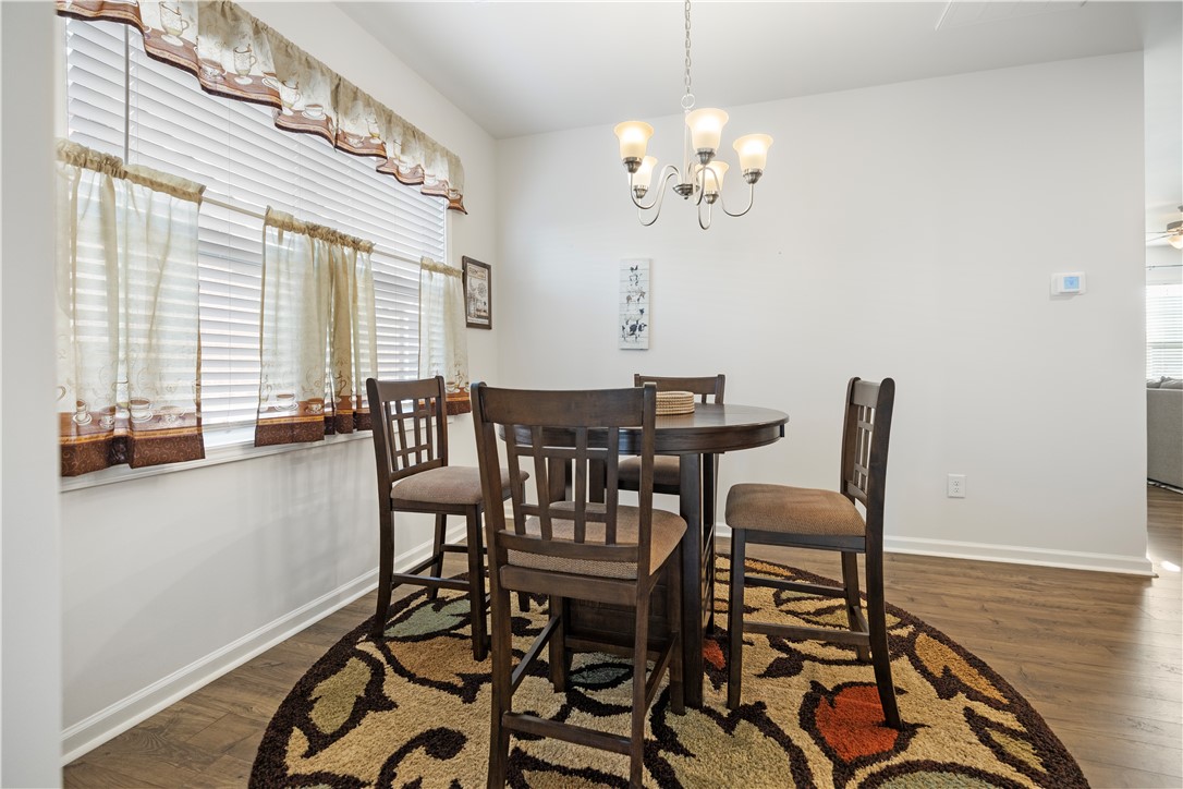 104 Village Main Anderson, SC 29621 - Photo 11 of 30 This inviting dining area features ample natural light and elegant wood flooring, perfect for daily meals.