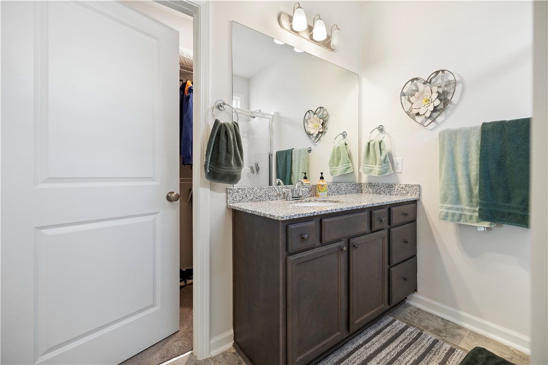 104 Village Main Anderson, SC 29621 - Photo 16 of 30 This bright bathroom features a spacious vanity with ample storage and a large mirror.
