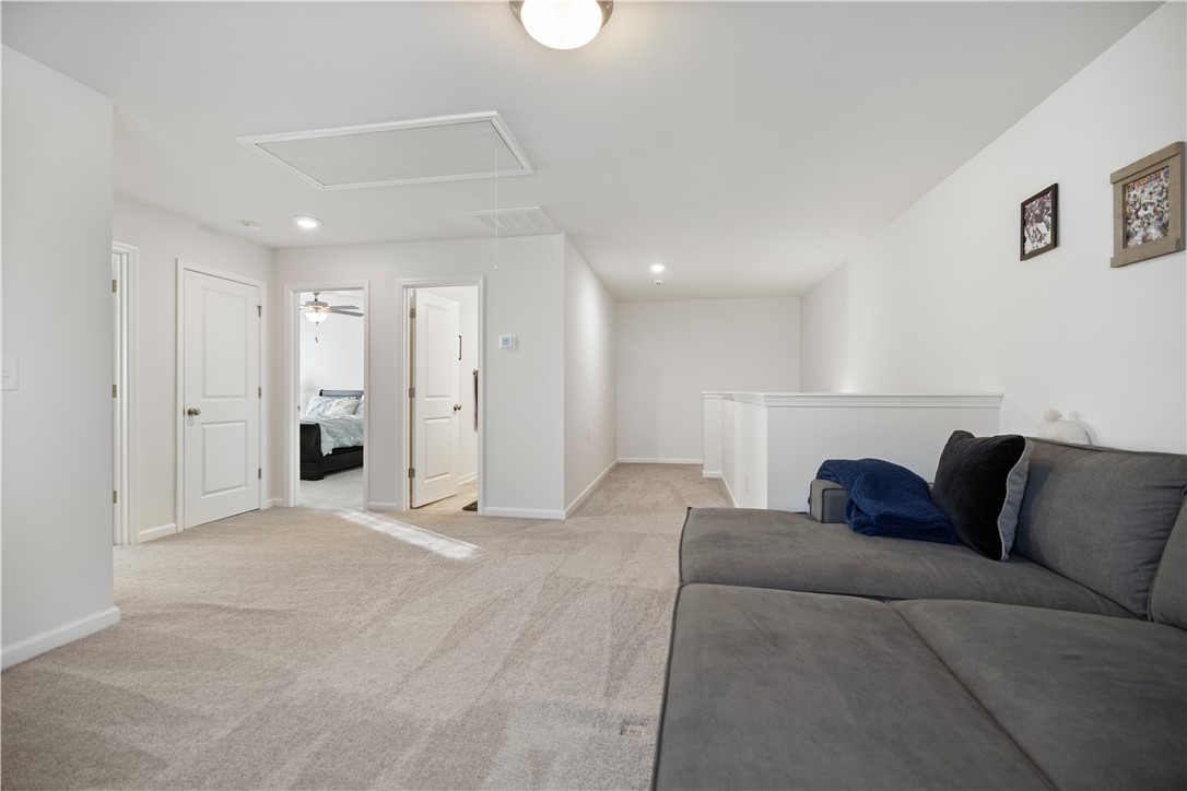 104 Village Main Anderson, SC 29621 - Photo 19 of 30 This versatile loft area offers comfortable living with soft carpeting.